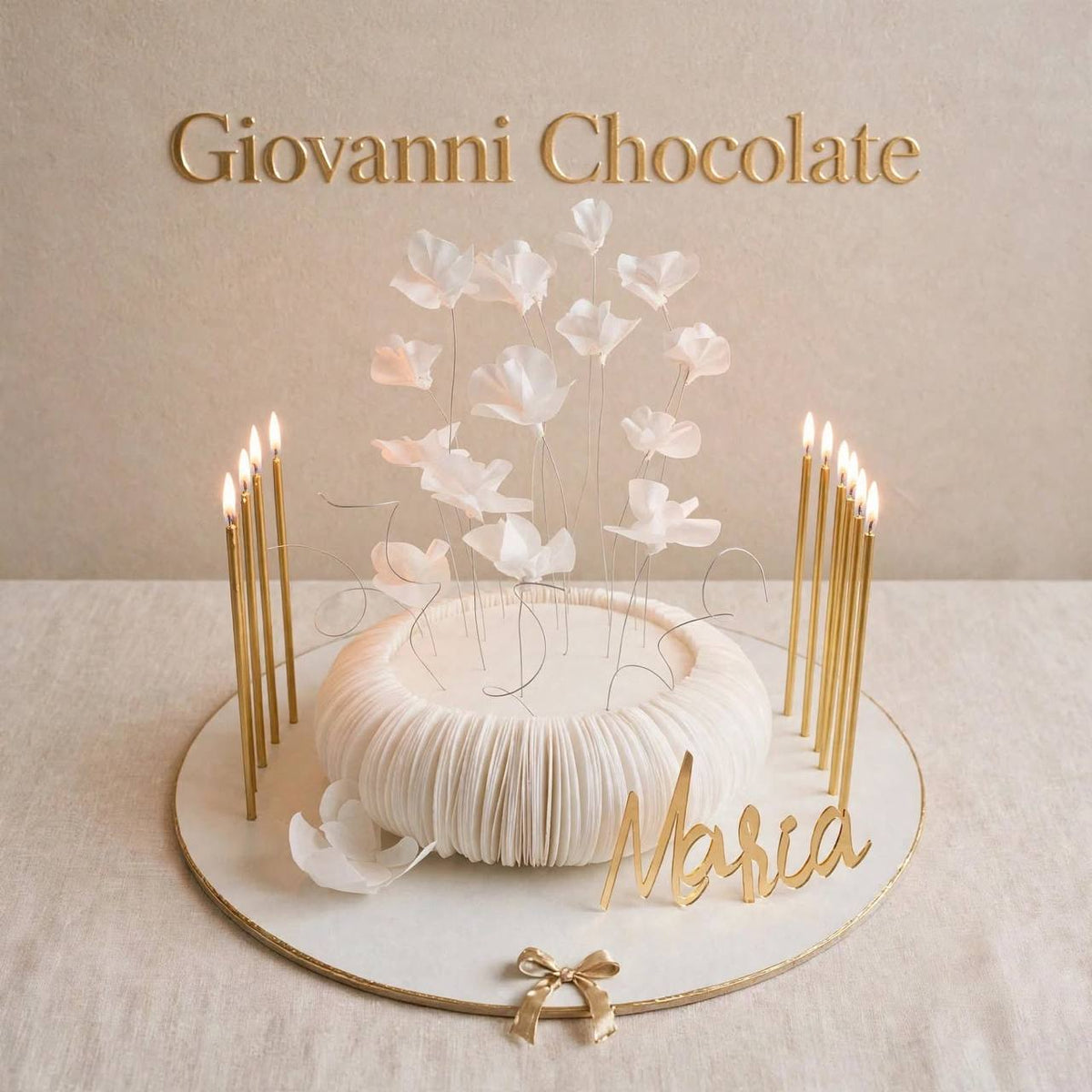 White ruffle cake with gold candles and a custom name | GC-42