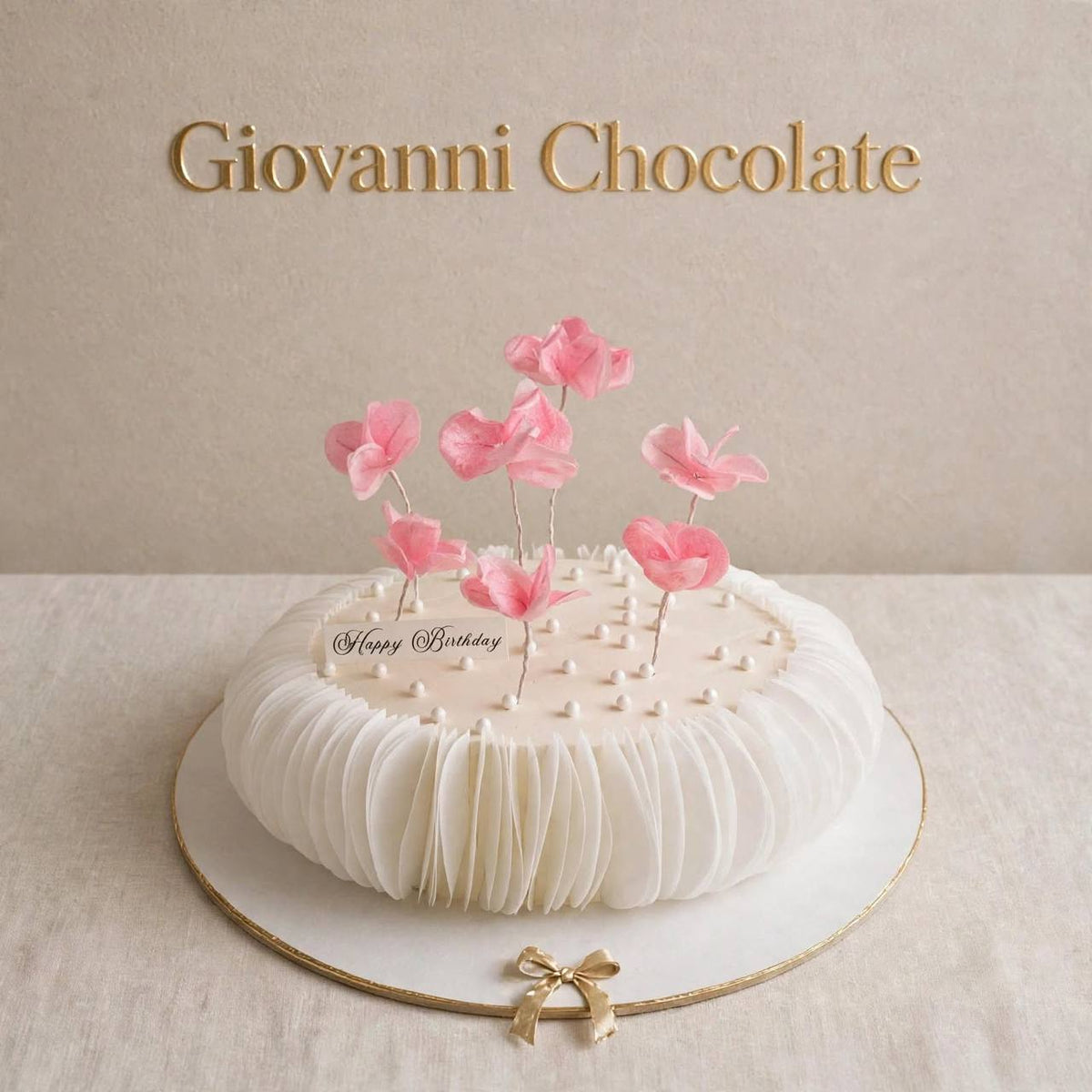 White cake with floating pink blossoms | GC-93